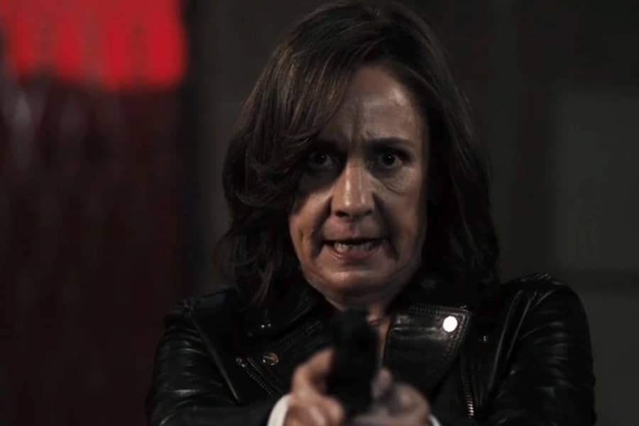 Watts pointing her gun