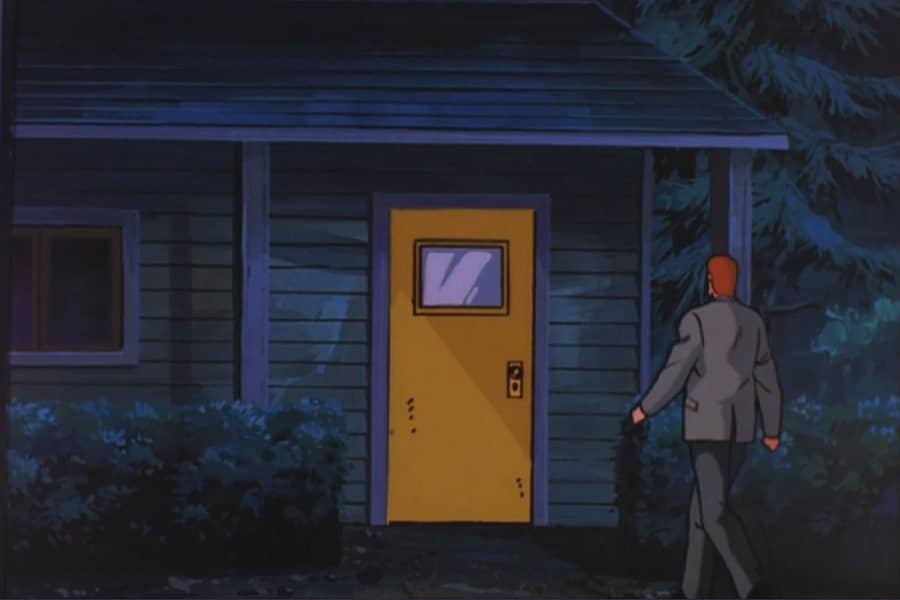 man walking toward a house