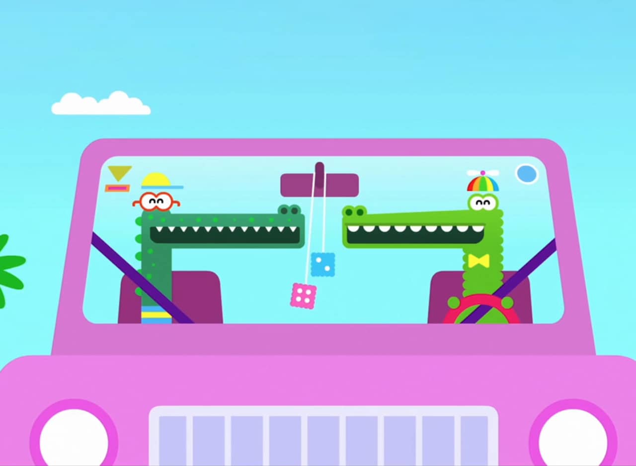 Feliz and Enrique, two alligators, driving in the car on a sunny day