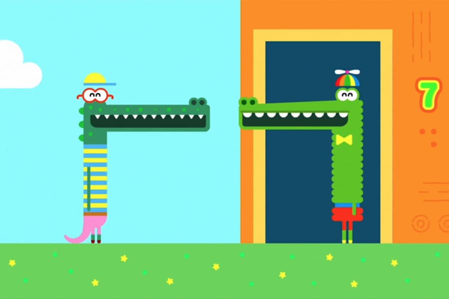 Feliz and Enrique greeting each other at the door