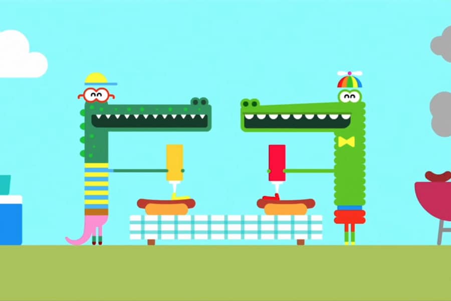 Feliz and Enrique making hot dogs at a picnic