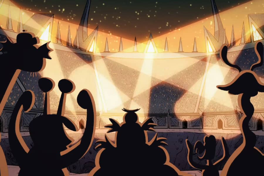 crowd cheering as spotlights fill the arena