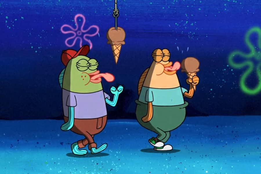 two kids walking and eating ice cream, one kid doesn’t realize yet that his ice cream has been hooked