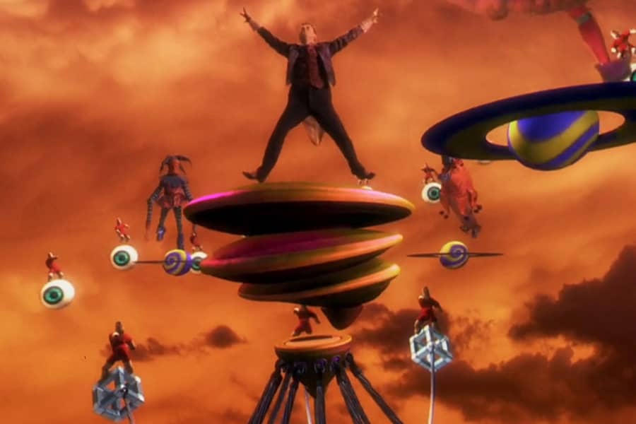 Floop dancing on a platform under an orange sky surrounded by surrealist floating eyeballs and dancing finger people