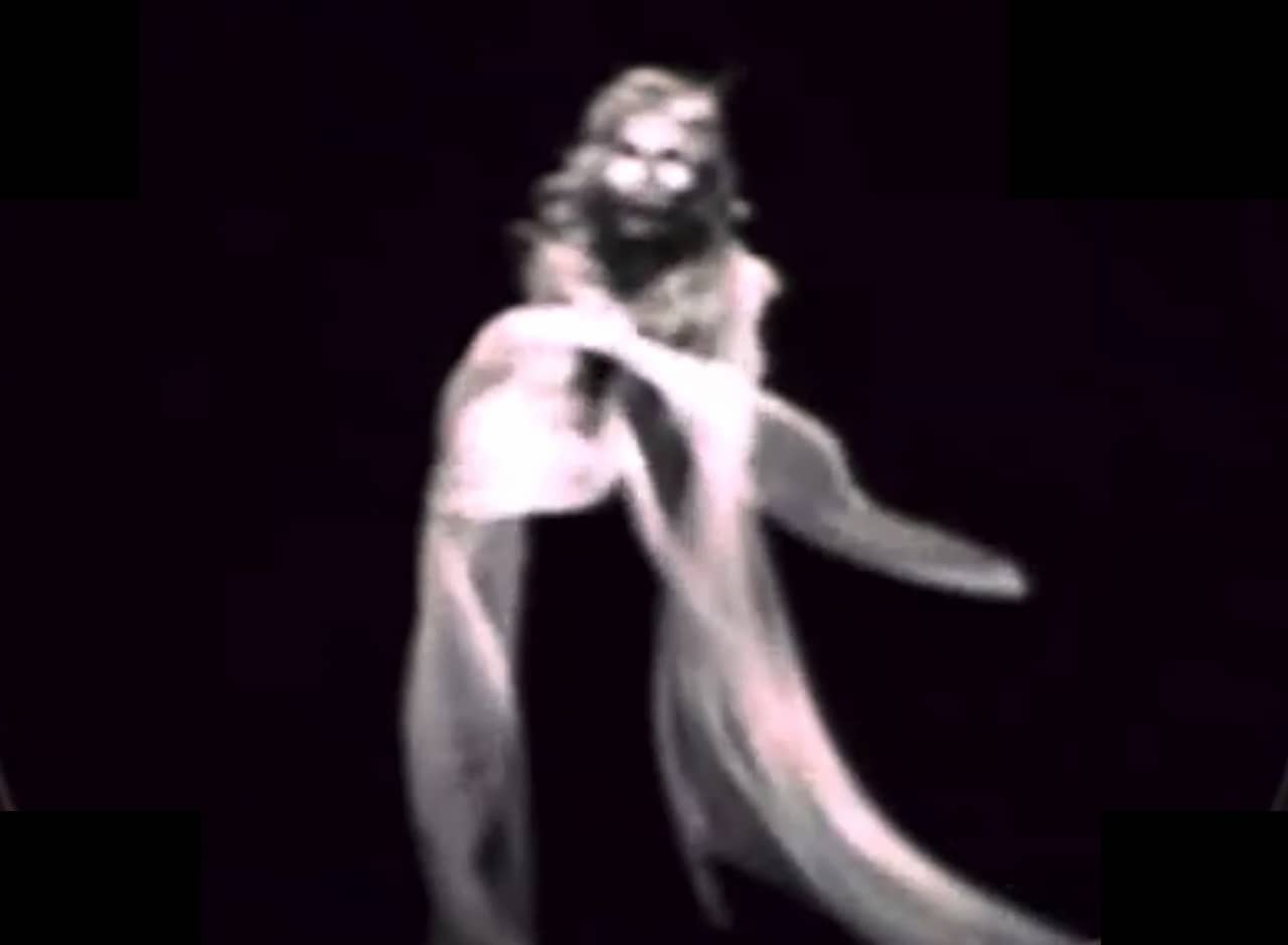a ghost against a black backdrop