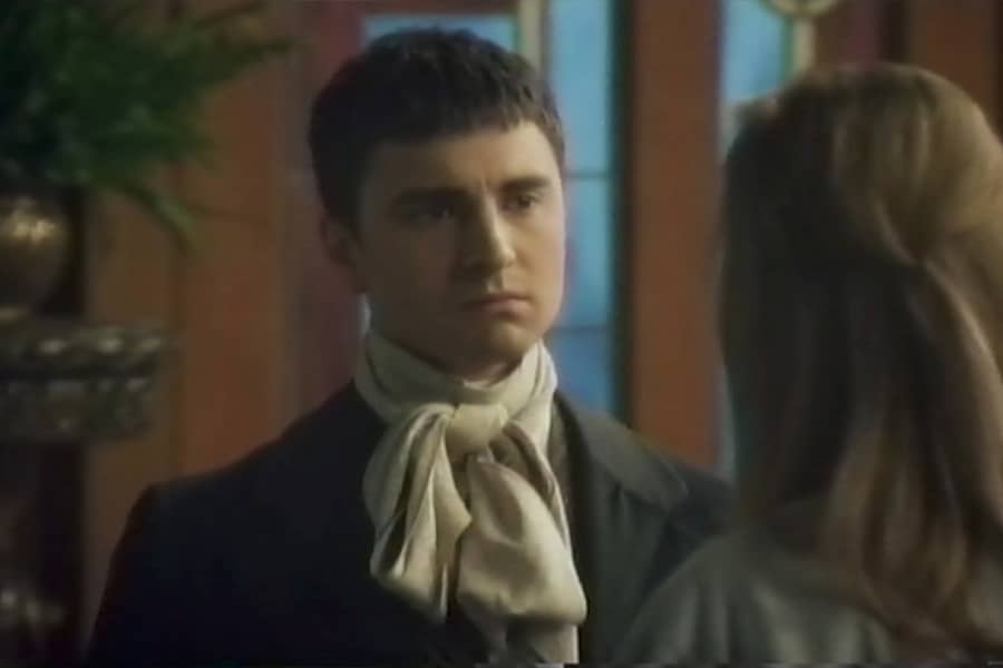 the young man speaks with another woman