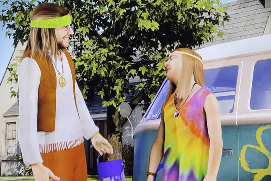 two hippies painting a van