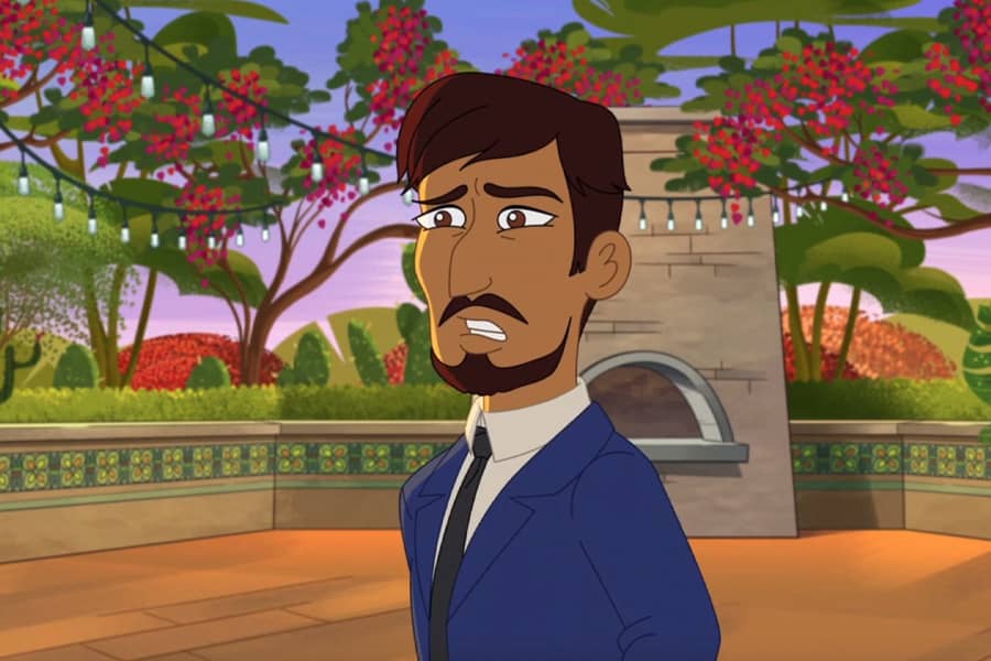 man looks concerned in a flowery courtyard