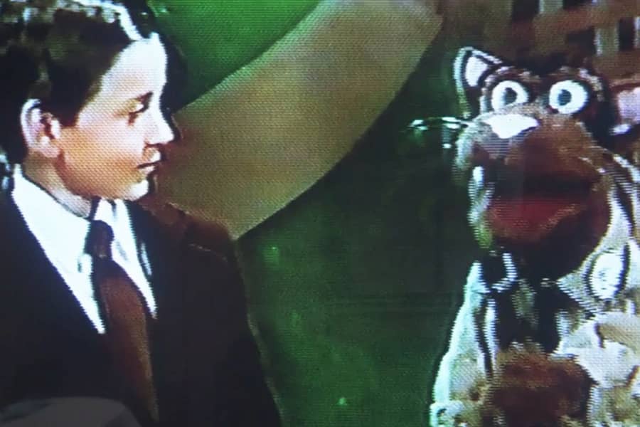 Edward R. Meow talks with a young Michael Scott