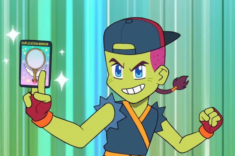 the boy holds up a Duplication Mirror Galaxu card