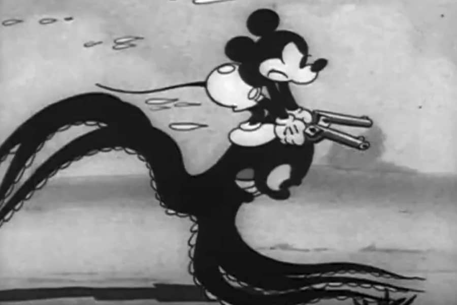 Mickey riding a galloping octopus while wielding two guns