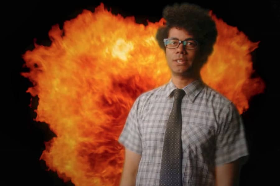 Maurice with a CG explosion behind him