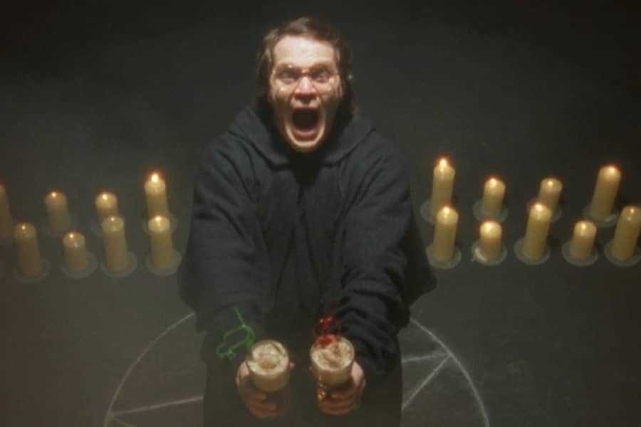 Garth screaming, standing in the middle of a satanic ritual holding two coke floats