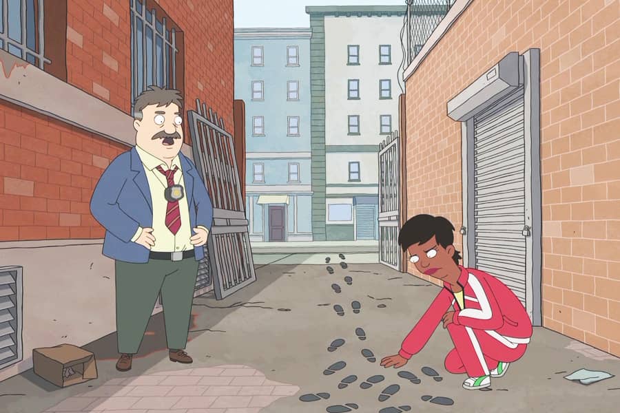 Gina kneels in an alley to examine some footprints while a mustached cop talks nearby