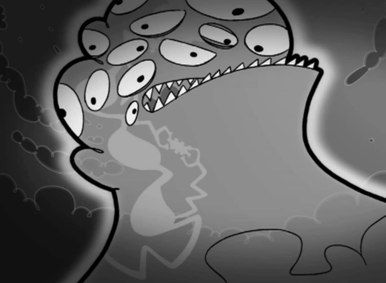 giant globby alien with lots of eyes and sharp teeth