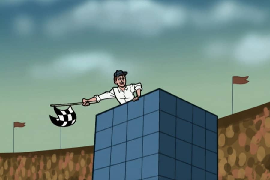 man in racetrack tower waving checkered flag