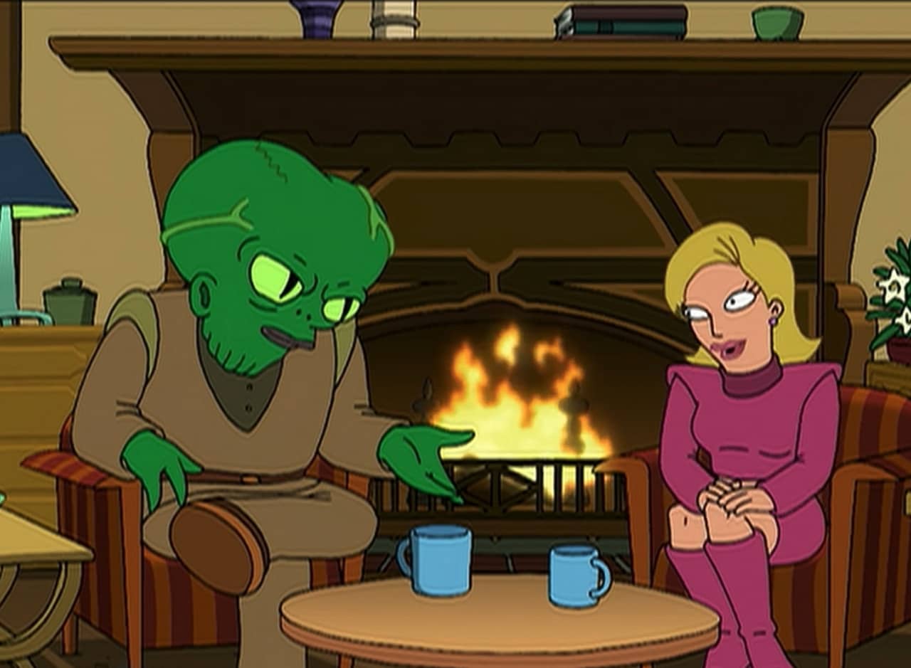 Morbo and Linda sitting by a fire