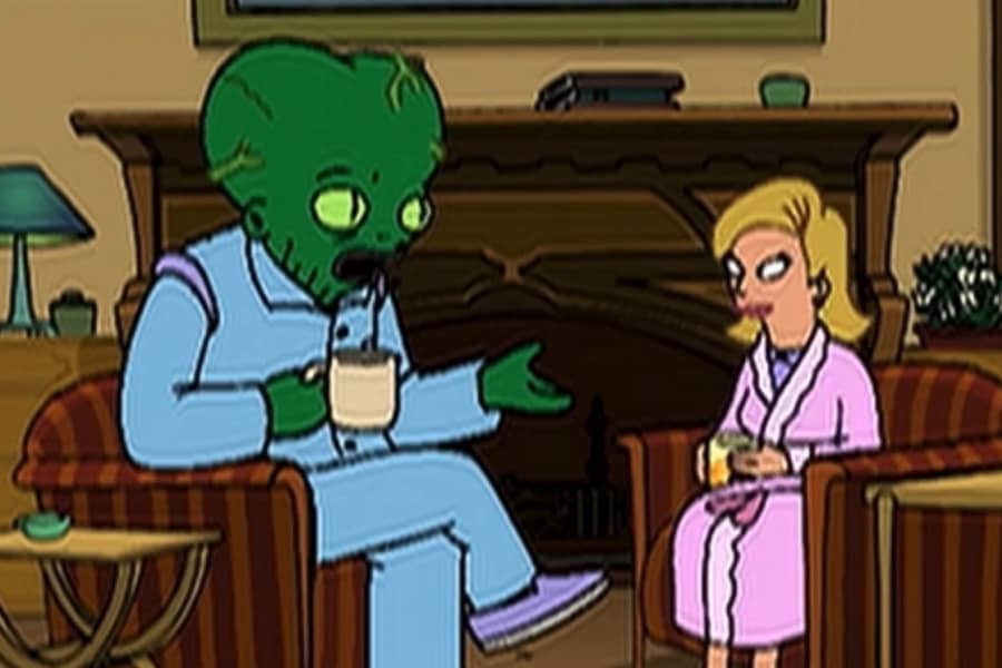 Morbo and Linda in pajamas and holding coffee