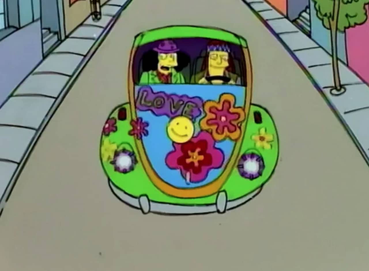 Good-Time Slim and Uncle Doobie driving in a hippie VW Bug