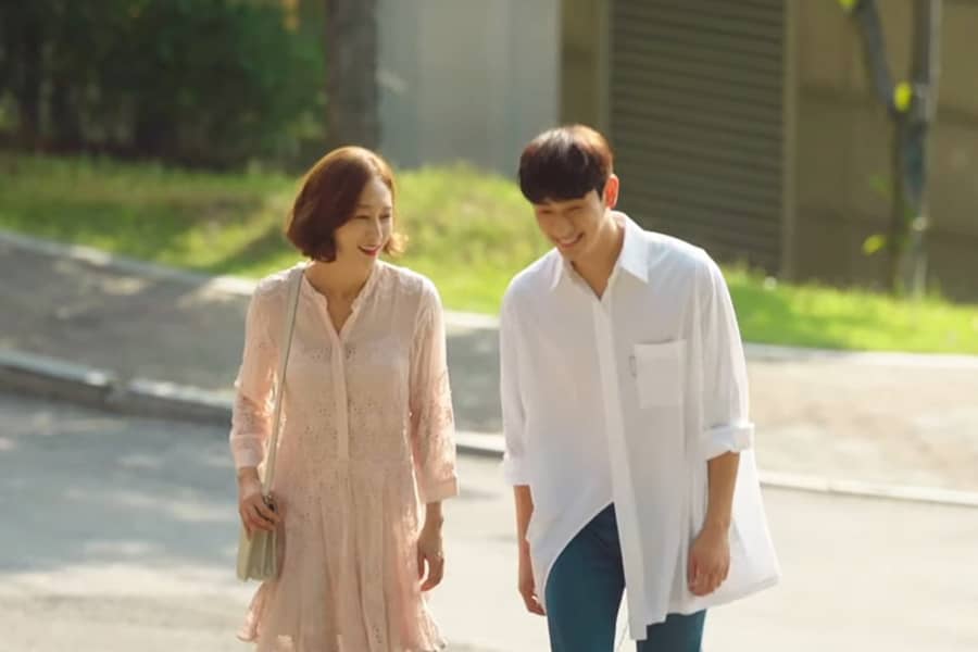 the couple walk happily down the street