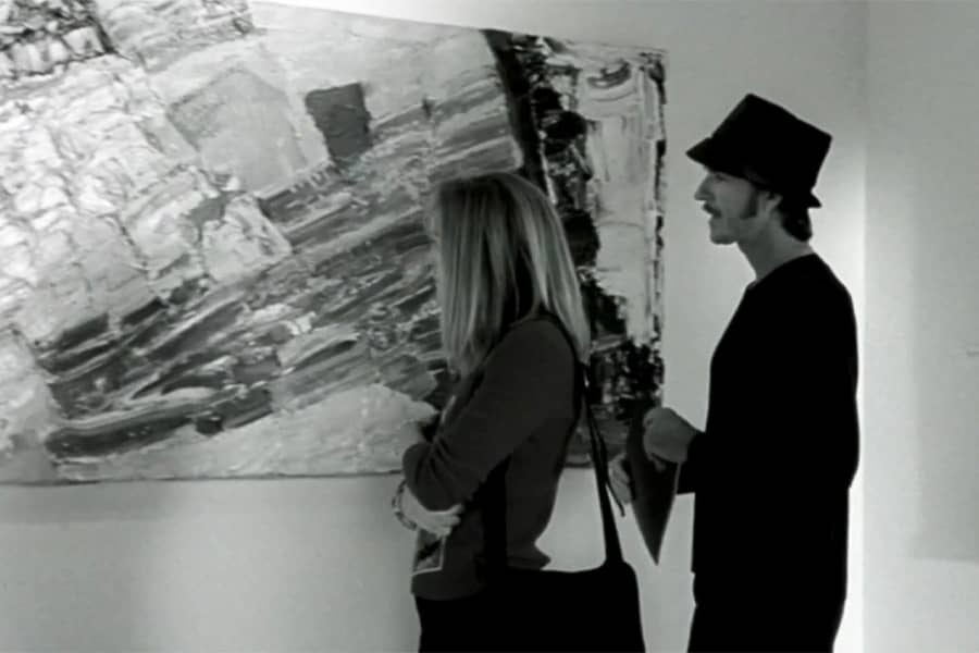 the couple looks at art
