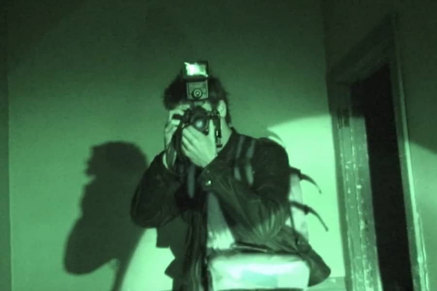night vision of Lance taking a photo