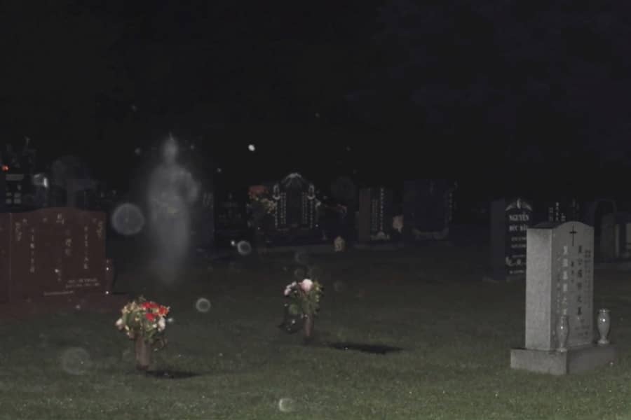 a ghost in a graveyard