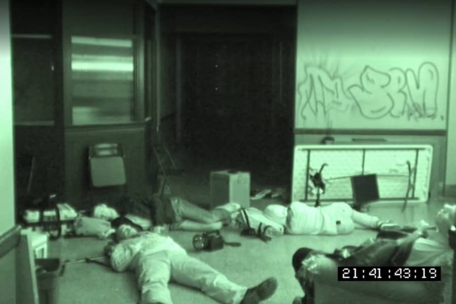 night vision of the team sleeping on the floor of an asylum
