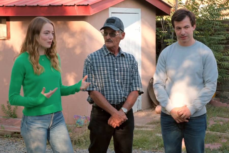 Asher and Whitney speak with a local resident