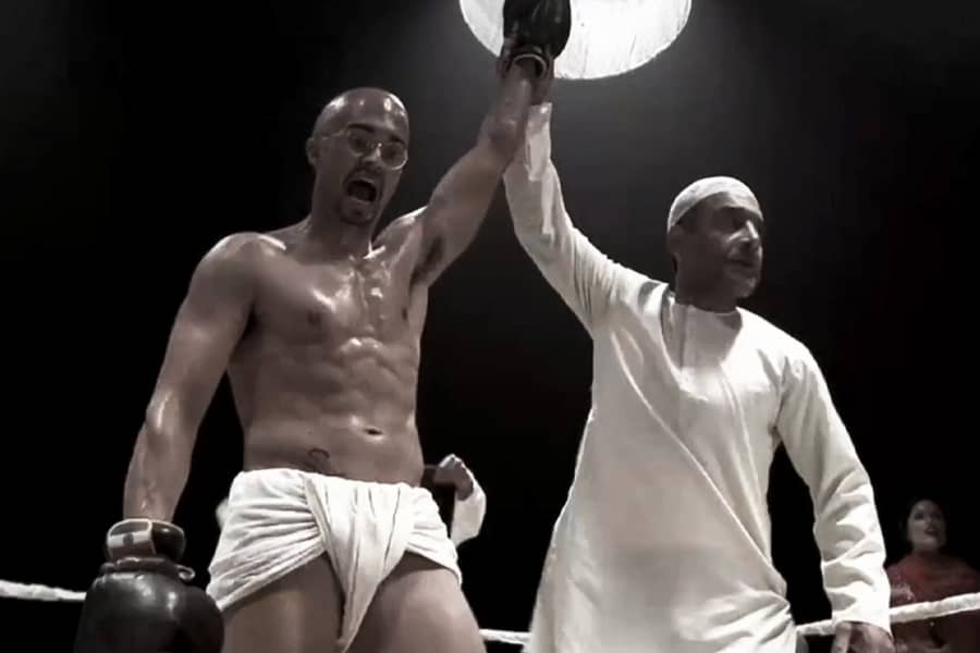 Gandhi raises his fist as the winner