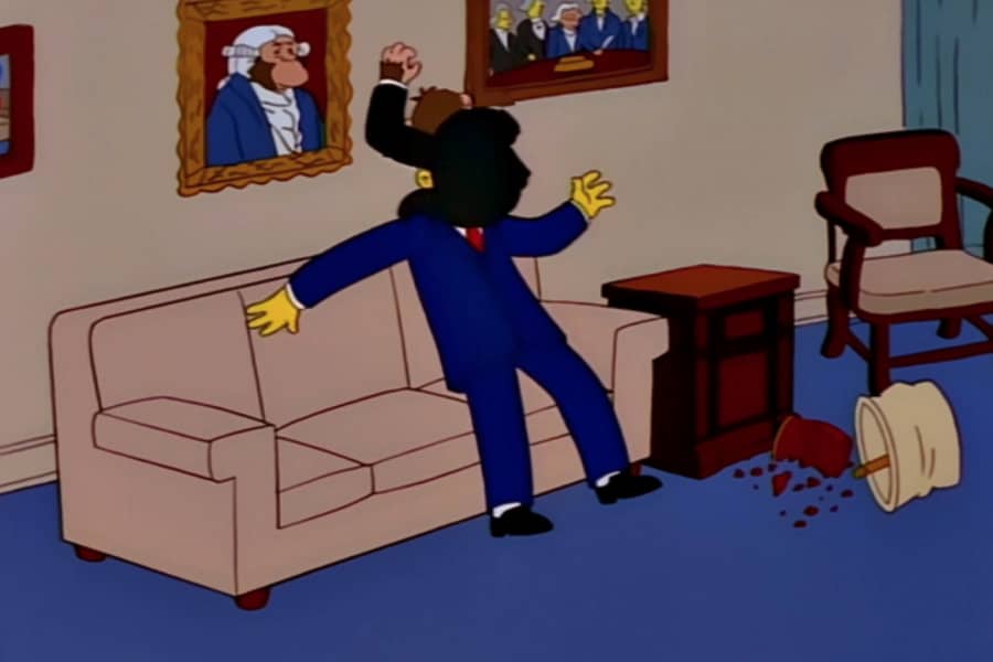 chimp President attacking a man’s face