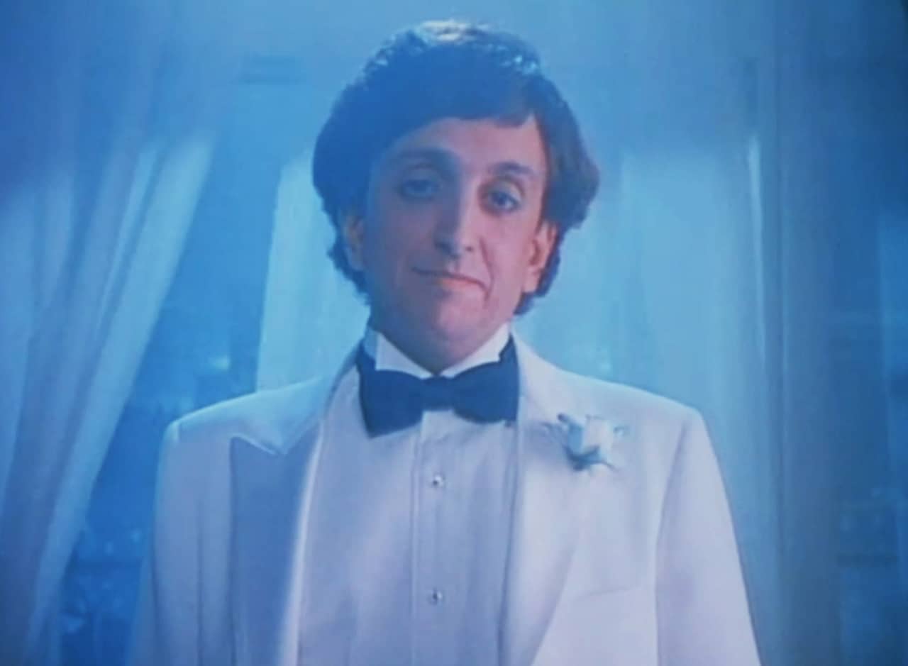 Hamilton Rogue, an unassuming man in a white tux