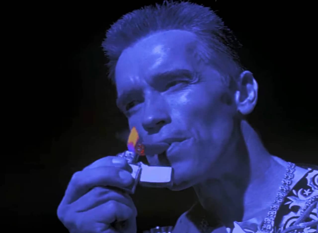 Arnold as a tough Hamlet lighting a cigar