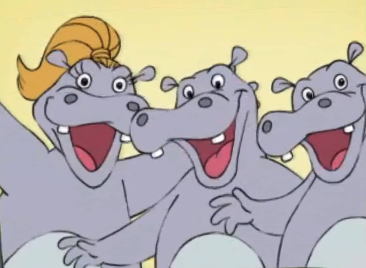 three dancing and smiling hippos