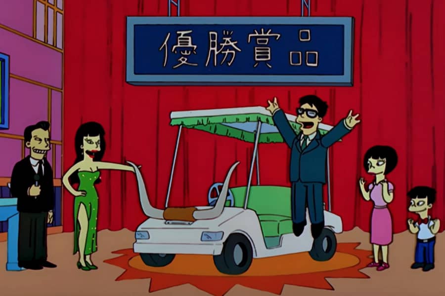 Japanese family winning a golf cart with bull horns on the front