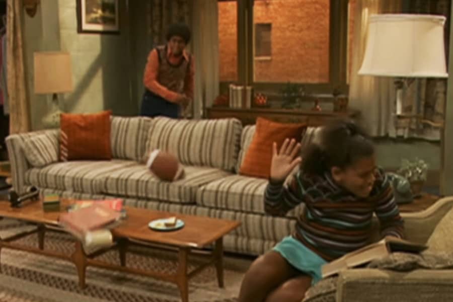 brother threw a football and knocked items off the coffee table
