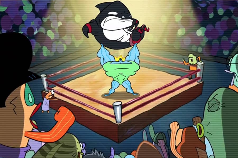 wide shot of Sardina lifting Dwayne in a fighting ring surrounded by an audience