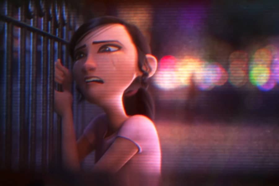 woman grips metal gate and cries