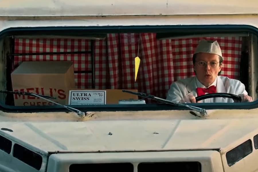 delivery truck driver wearing a milkman uniform