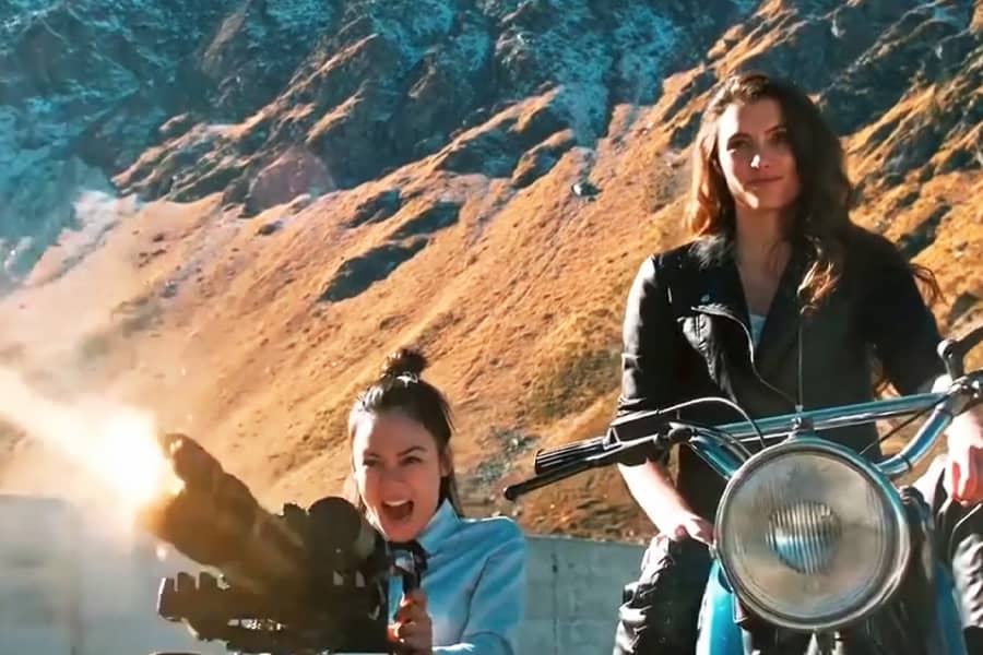 Klara shooting a gatling gun