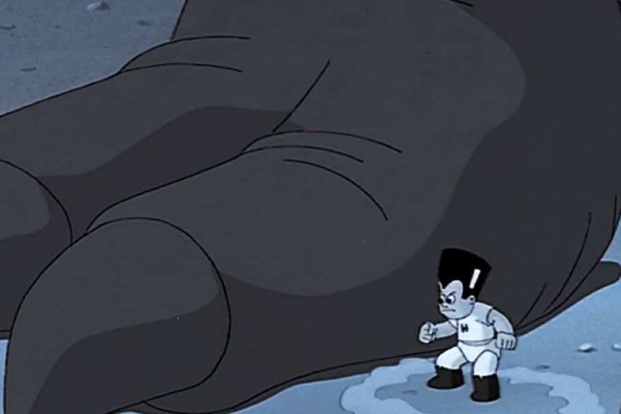 Hero Boy lands near the lizard’s giant foot