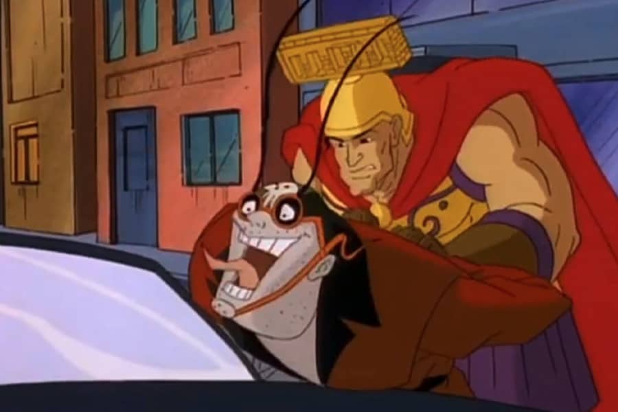 Spartan superhero arresting a villain