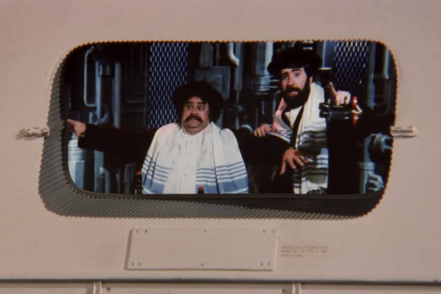 two rabbis look out a spaceship window
