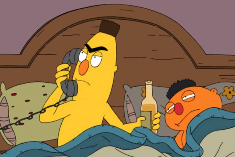 shirtless Bert answers the phone with a liquor bottle in hand, Ernie awakes next ot him