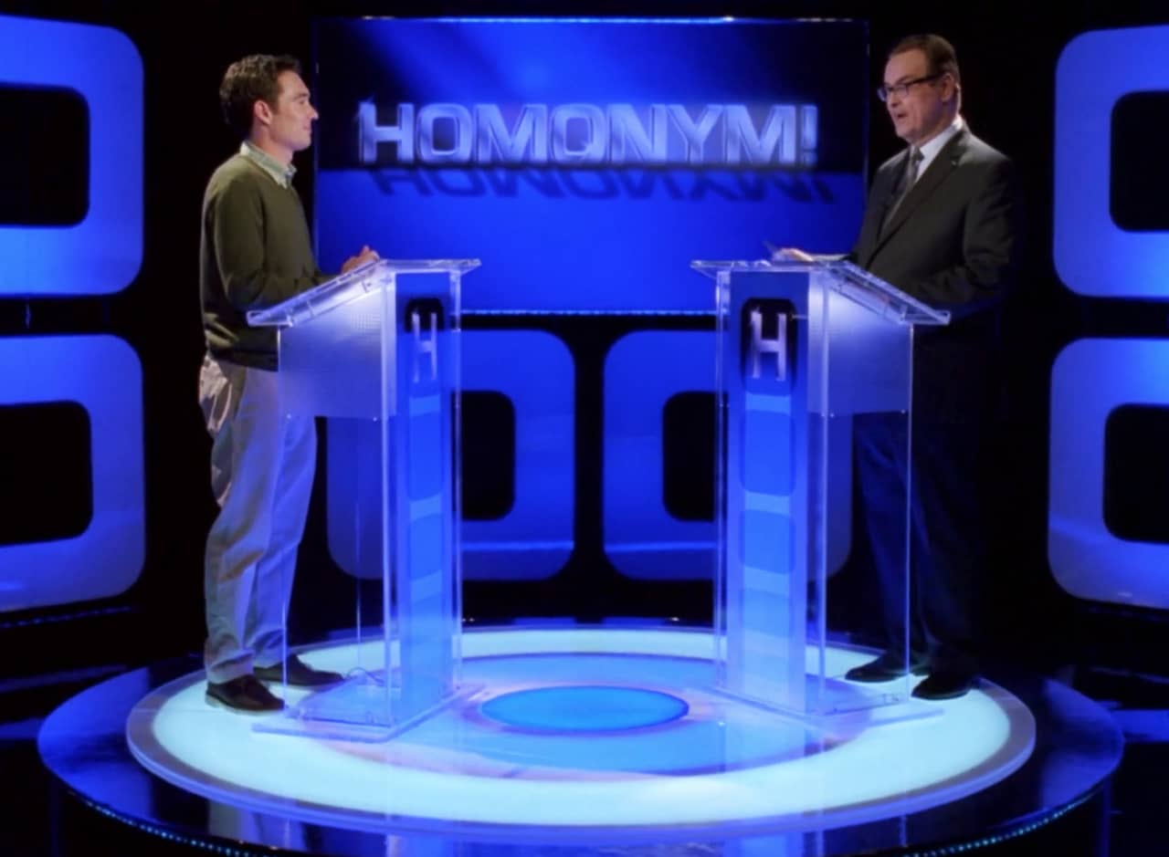 Homonym set, with Steve Higgins and a contestant each at a podium