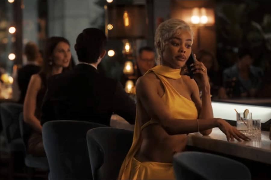 Teyana Taylor on the phone at a bar