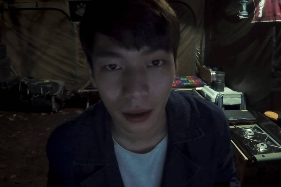 Ha-joon on webcam in a tent