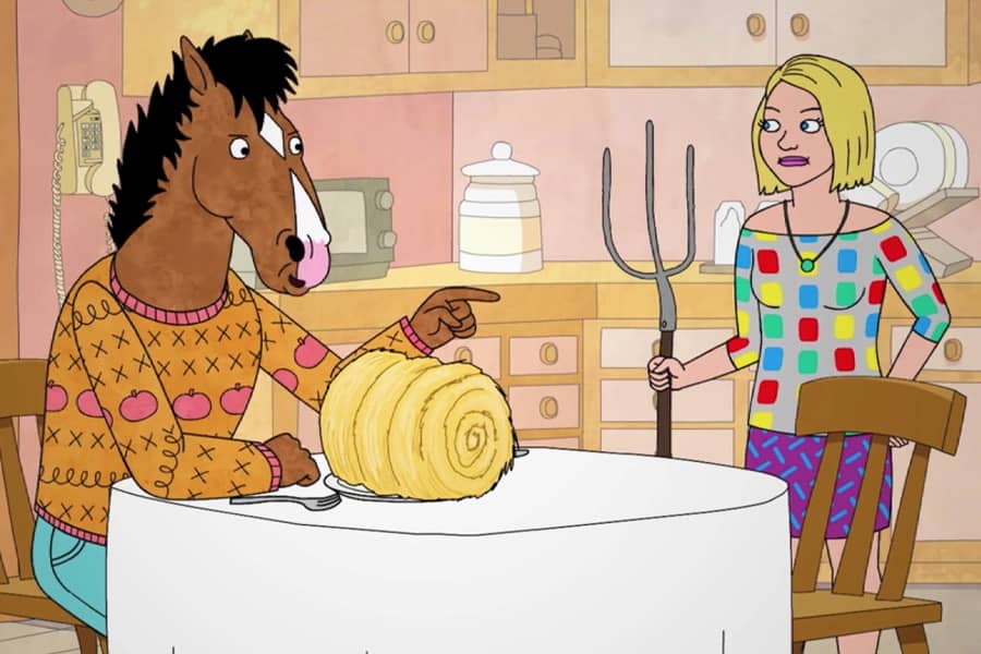 Olivia serves the Horse a roll of hay with a pitchfork