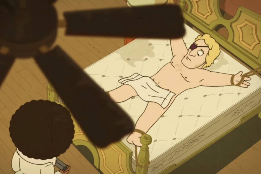 Cocoa Bang Bang approaches a white naked guy strapped to a bed
