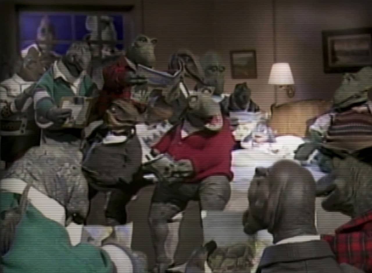 little kid dinosaur in bed while a dozen dad dinosaurs read to her simultaneously